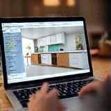 3D kitchen render on laptop during design review